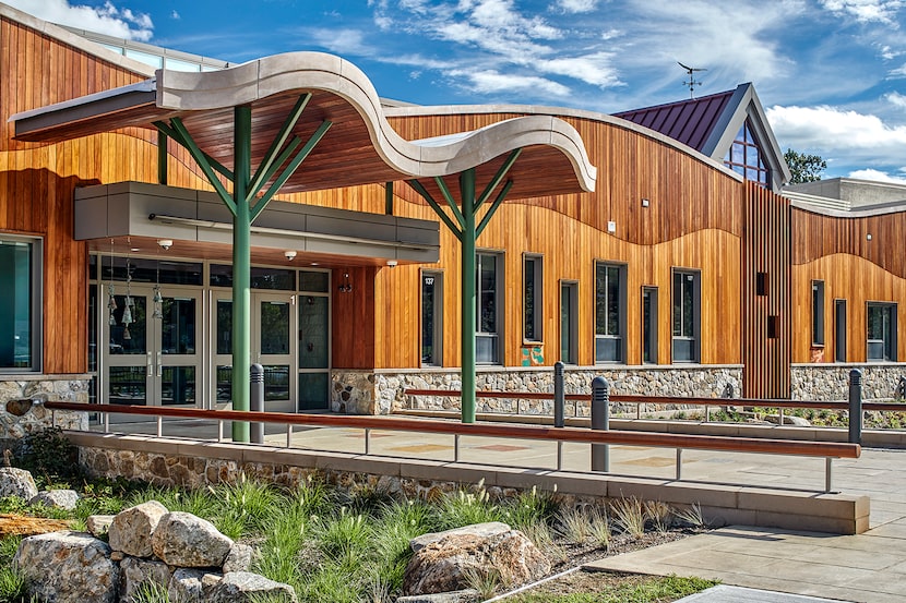 A footbridge leads to the entrance of Sandy Hook Elementary, as beautiful as it is secure.