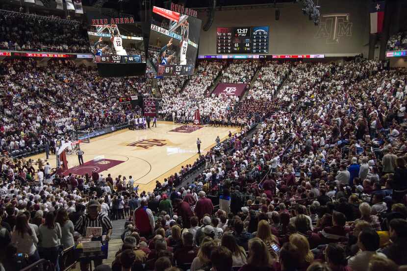 A new central-hanging scoreboard inside Reed Arena is part of a Texas A&M campus-wide...