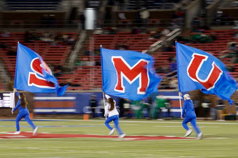 SMU flag runs on the field against UNT during the second half of a football game at Gerald...