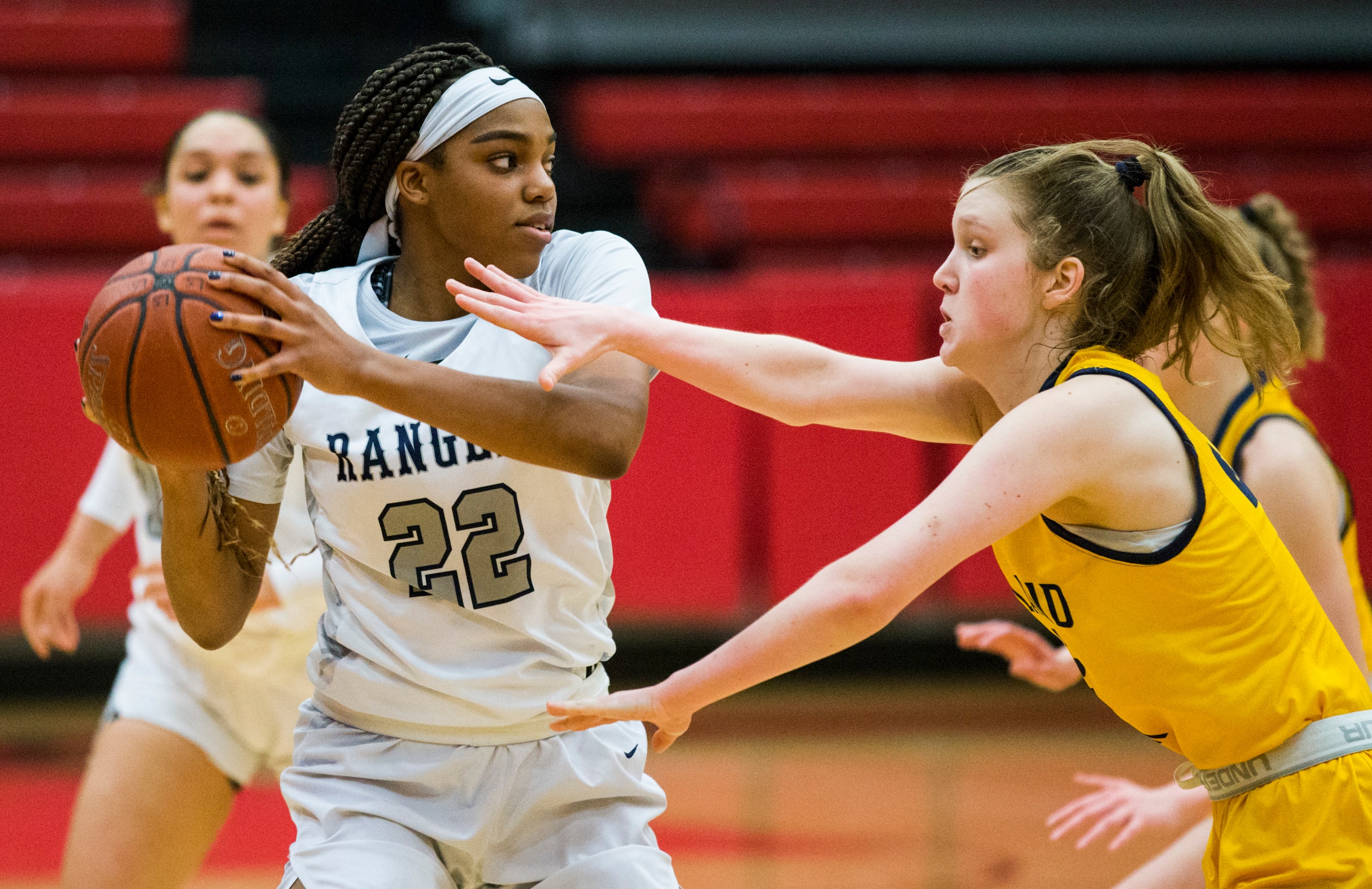 Frisco Lone Star forward Victoria Gooden (22) keeps the ball away from Highland Park guard...