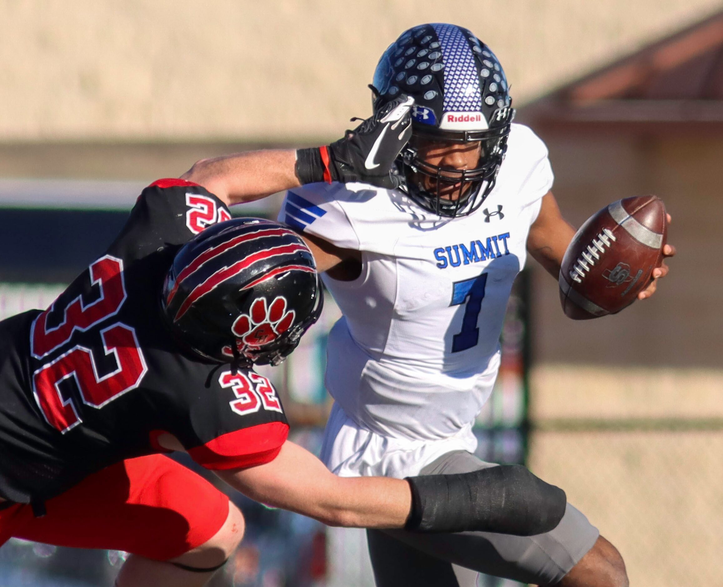 Colleyville Heritage linebacker Luke Lingard (32) tackles Mansfield Summit quarterback David...