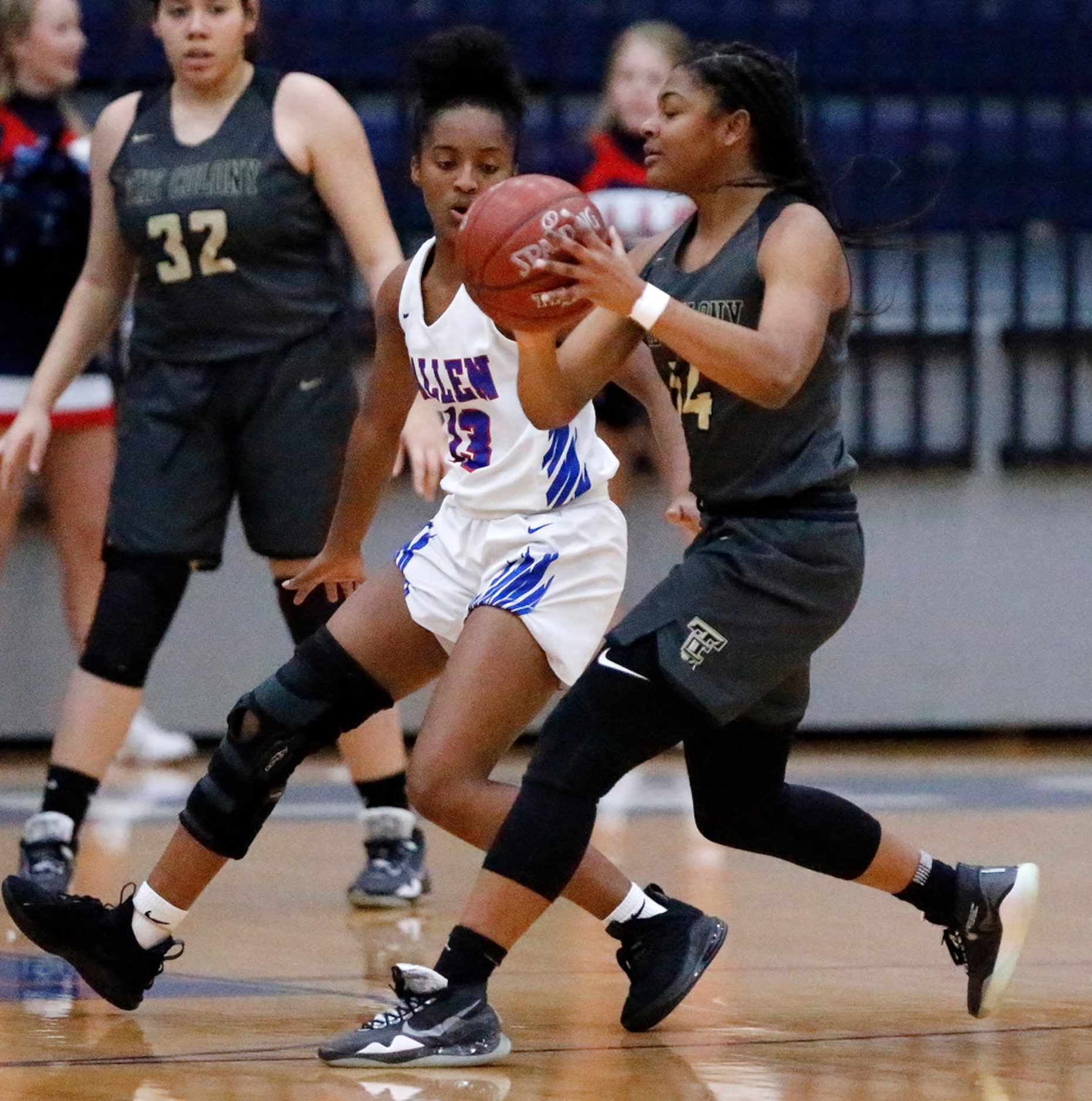 The Colony High Schoolâs Tamia Jones (14) passes while Allen High Schoolâs Zoe Jackson...