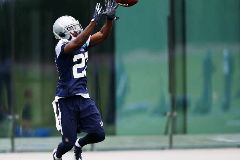 Dallas Cowboys cornerback Jourdan Lewis (27) leaps for a ball during rookie minicamp at The...