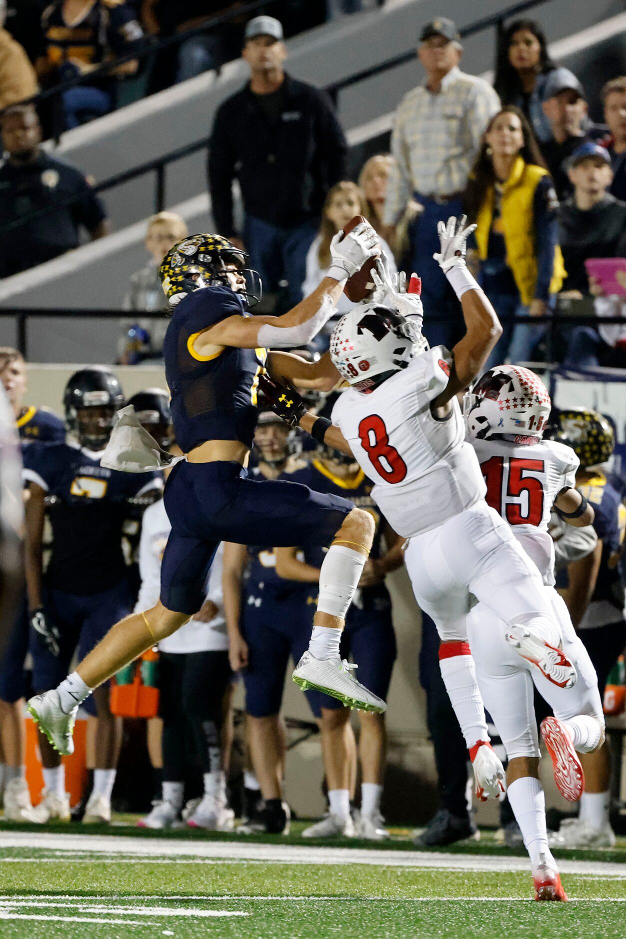 Stephenville’s Coy Eakin (2) makes a catch in front of Melissa’s Jacob Fields (8) and Trae...