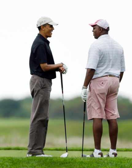  President Barack Obama (left) chats with former U.S. Trade Representative Ron Kirk while...