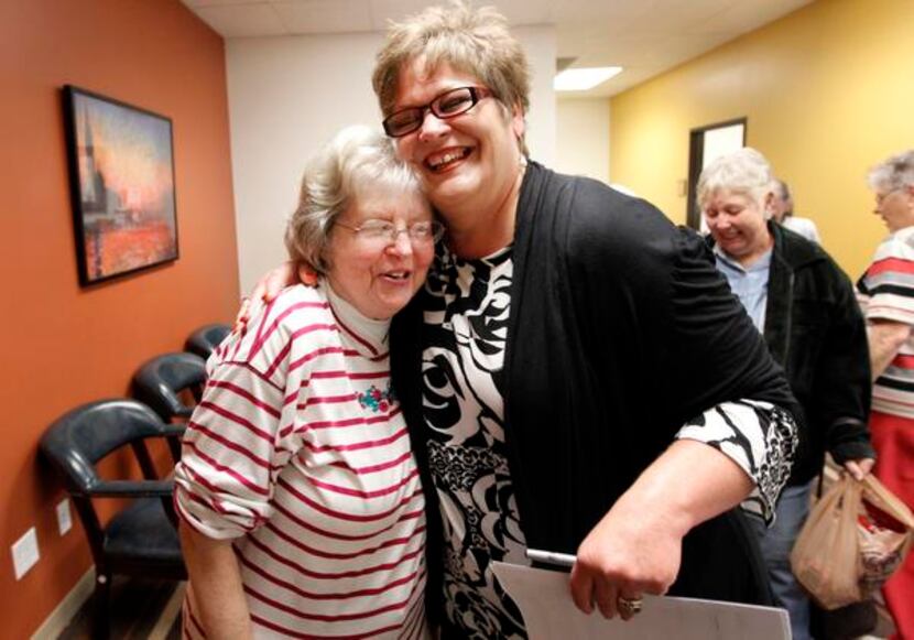 
Patty Covell, left, of Richardson, hugs with Debbie Childre, cq, the director of Seniors'...