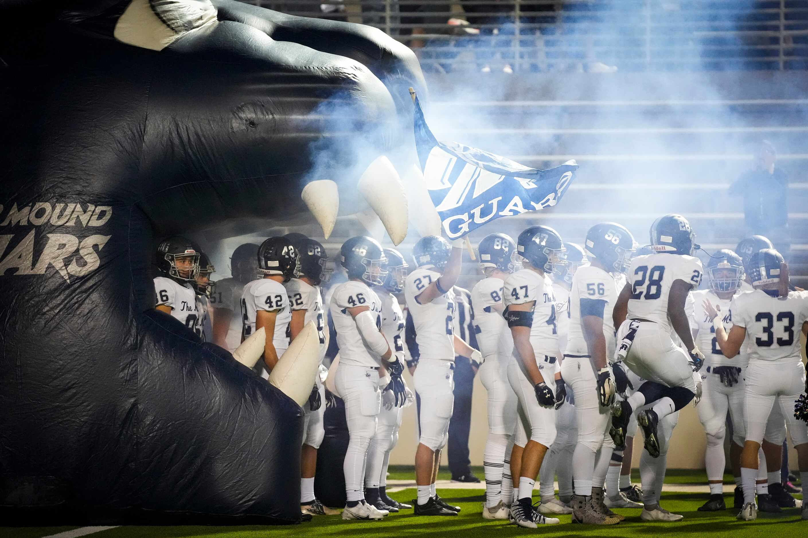 Flower Mound players prepare to take the field before a Class 6A Division II bi-district...