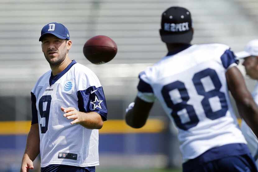 Dallas Cowboys wide receiver Dez Bryant (88) tosses the ball back to quarterback Tony Romo...