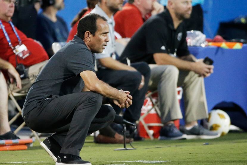 FC Dallas head coach Oscar Pareja looks on from the sidelines during the first half of an...