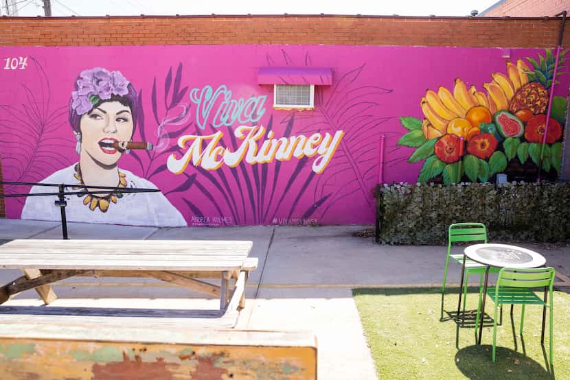 Andrea Holmes, a local mural artist who has painted 20 murals in downtown McKinney since the...