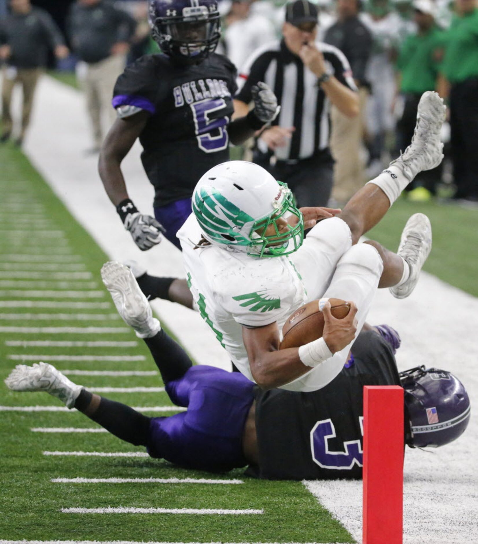 Lake Dallas running back Courtenay Holder (14) comes up just short of the pylon as he is...