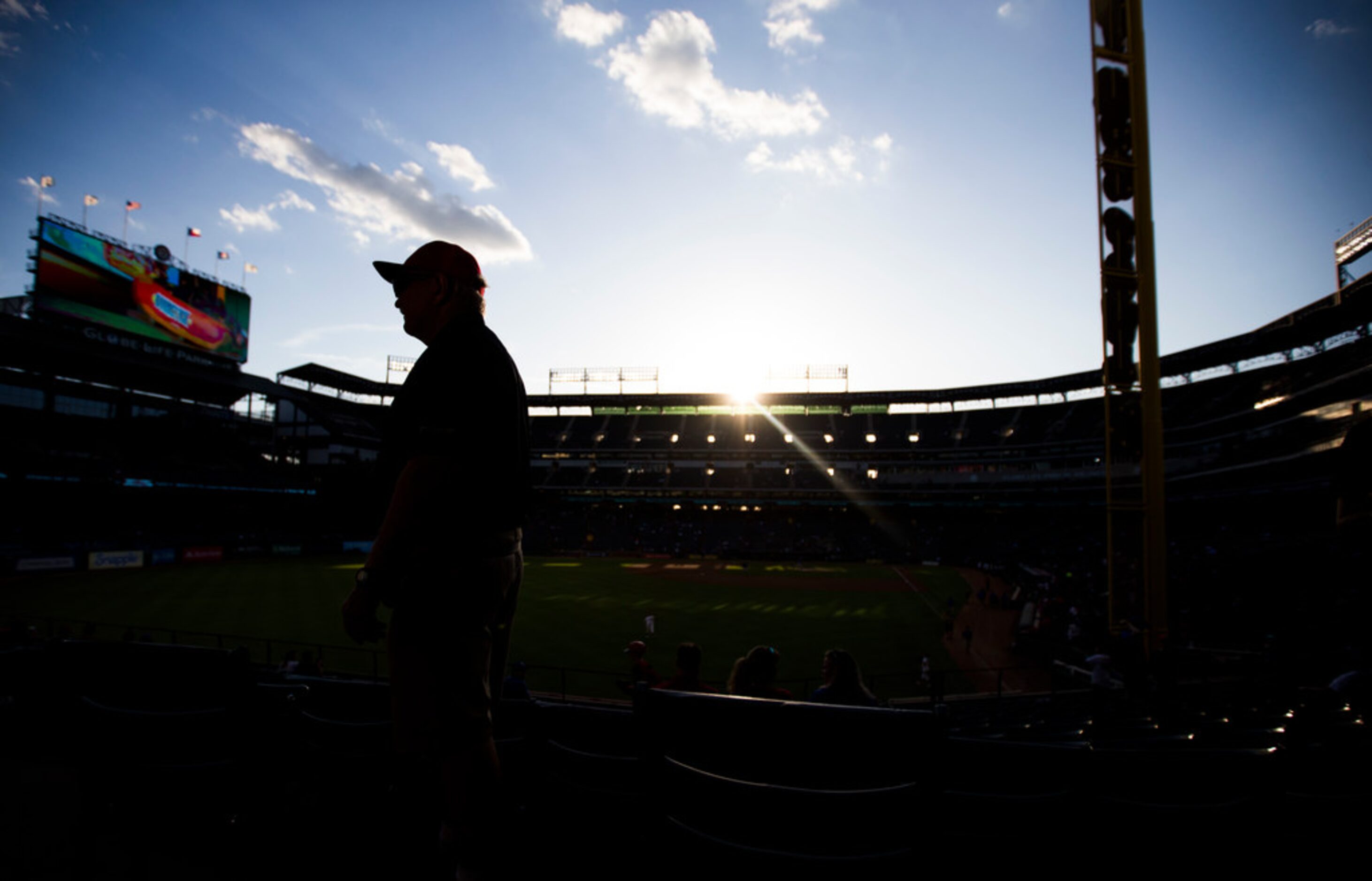 A Texas Rangers employee stands on the concourse before an MLB game between the Boston Red...