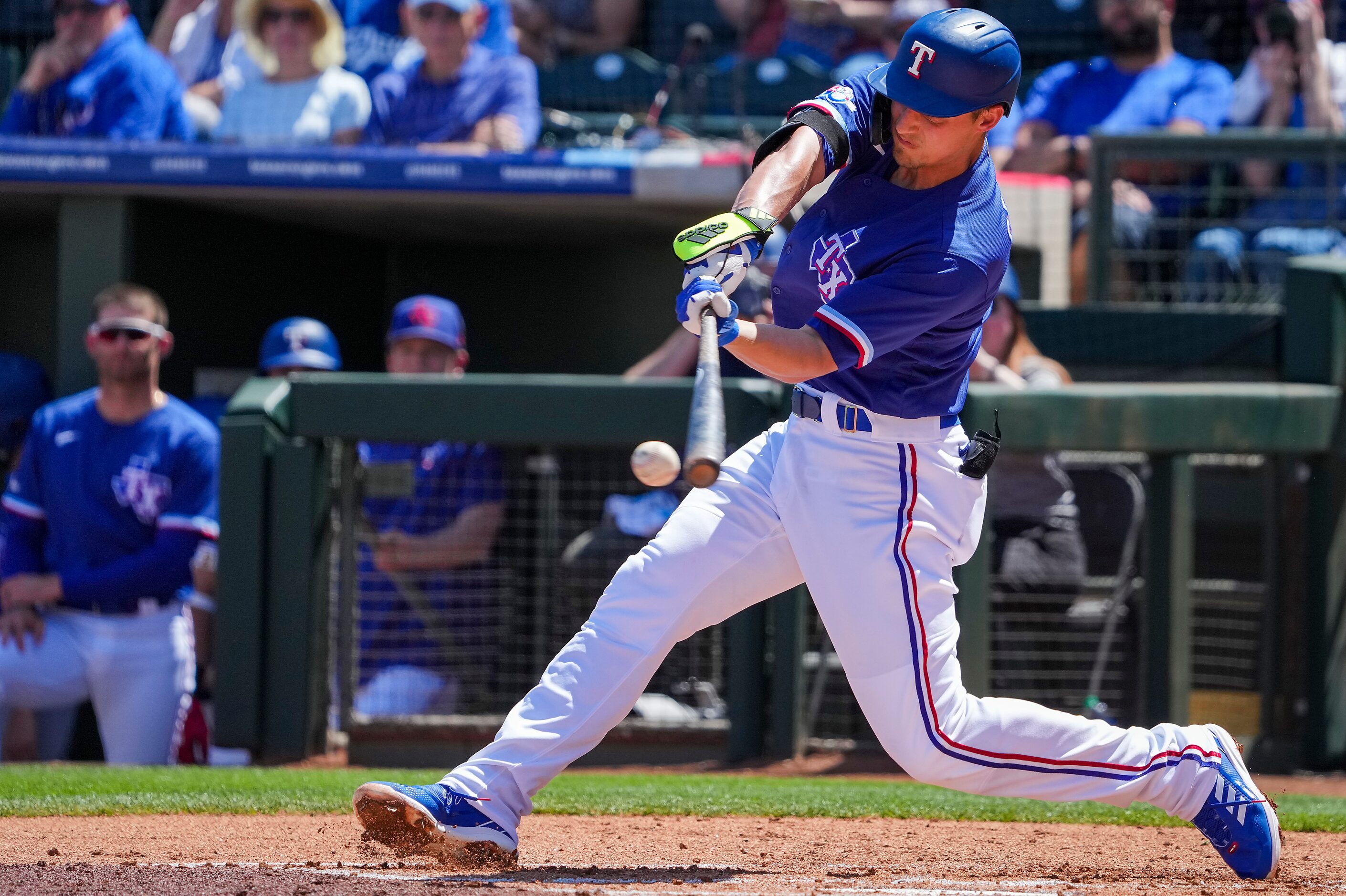 Texas Rangers shortstop Corey Seager bats during the first inning of a spring training game...