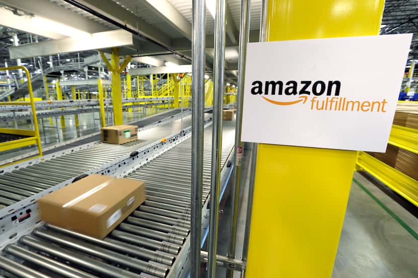A package moves along a conveyer belt at an Amazon.com fulfillment center in DuPont, Wash.