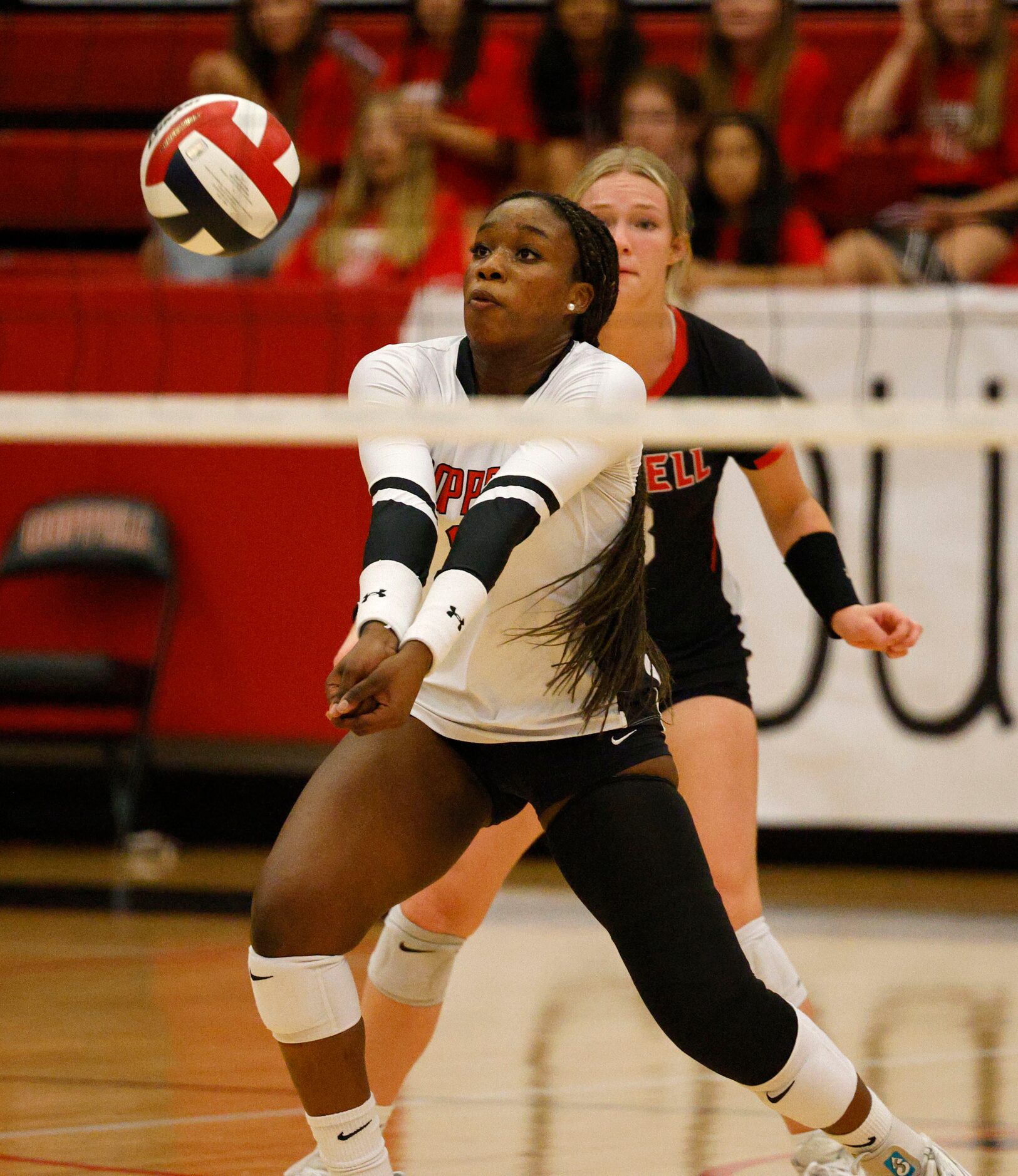 Coppell's Daki Kahungu (8) digs the ball against Flower Mound during a high school girl’s...