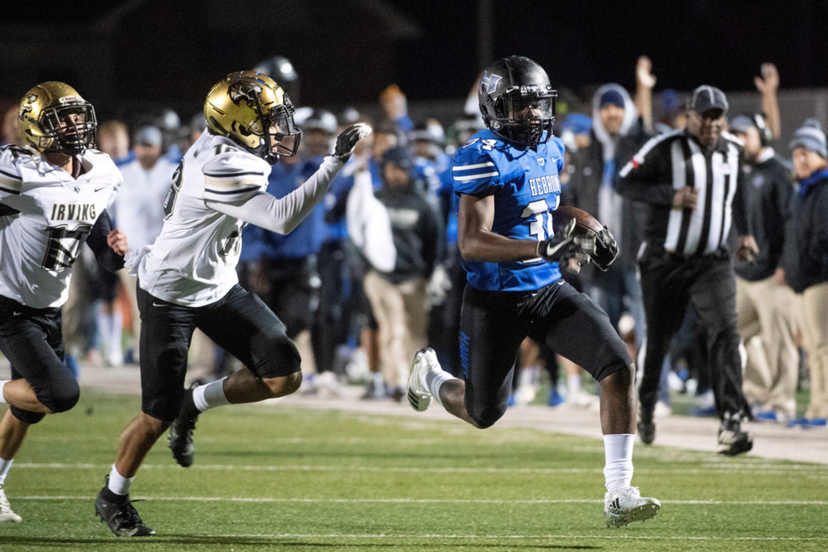 Hebron junior running back Kai Clincy (34) pulls away from Irving sophomore defensive back...