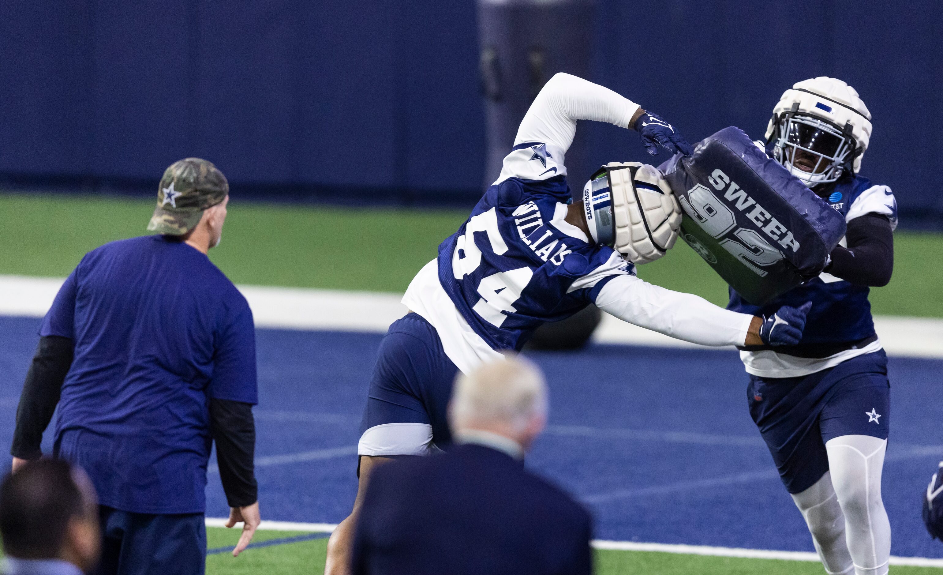 Dallas Cowboys defensive coordinator Dan Quinn, left, and owner Jerry Jones, bottom center,...