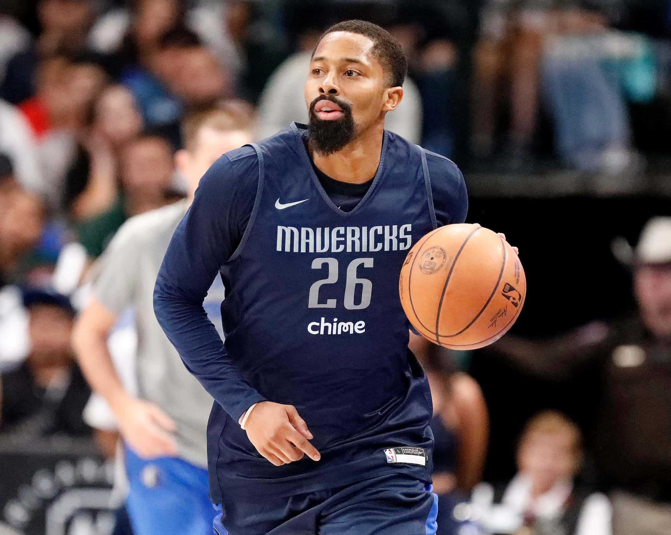 Dallas Mavericks guard Spencer Dinwiddie (26) brings the ball down the court at the Mavs Fan...