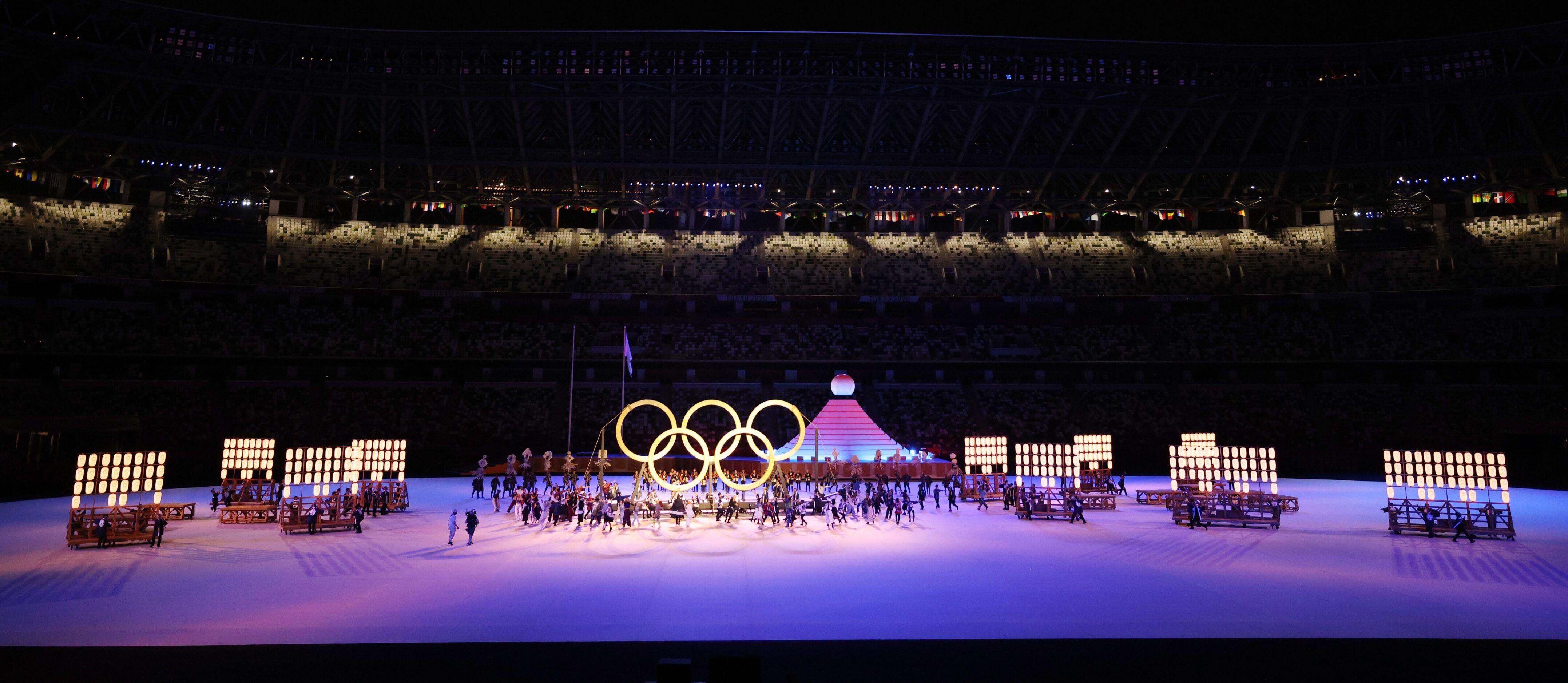 Entertainers bring out the Olympic rings as they perform during the opening ceremony for the...