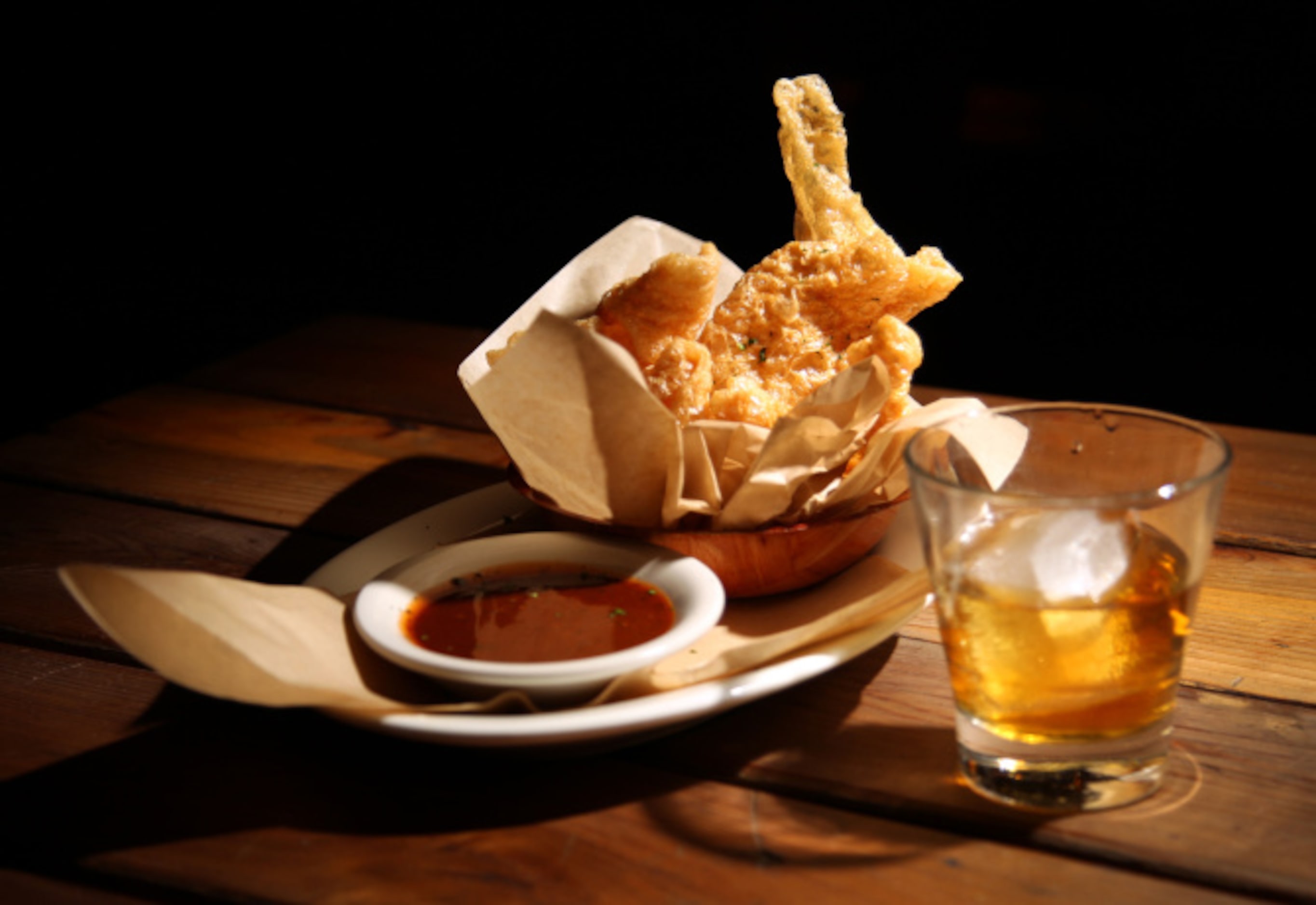 THE TRIED AND TRUE: Crackling pork rinds and a glass of bourbon