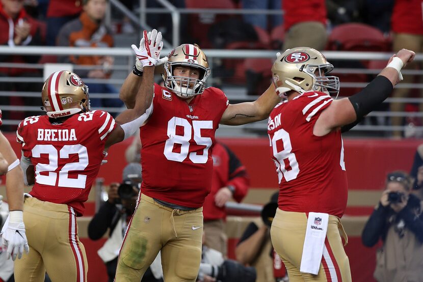 George Kittle (85) of the San Francisco 49ers celebrates a touchdown with teammates during...