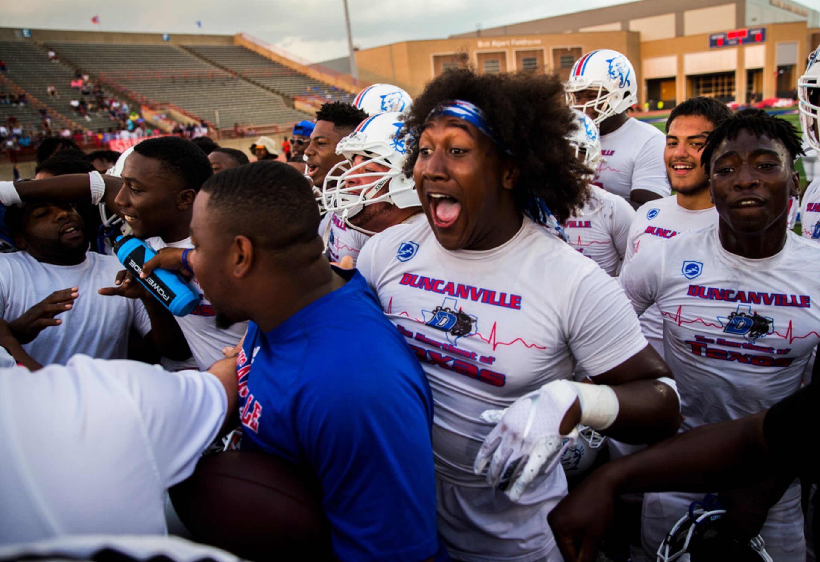 Duncanville linebacker Amari Wynn (52) and other football players trash talk Skyline...