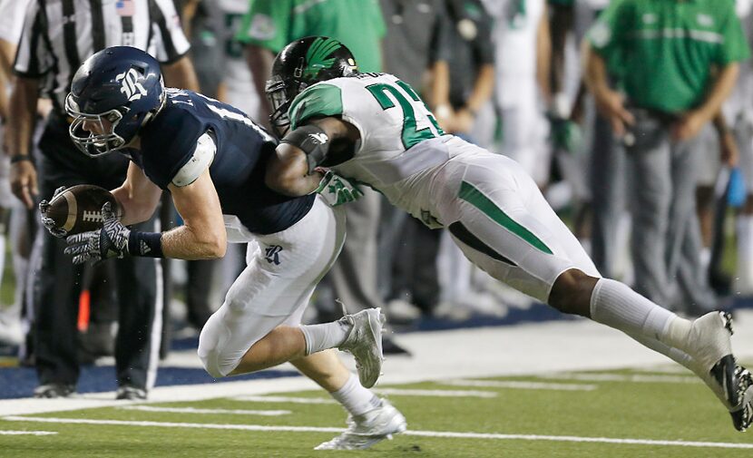 HOUSTON, TX - SEPTEMBER 24: Wide receiver Zach Wright #17 of the Rice Owls is tackled by...