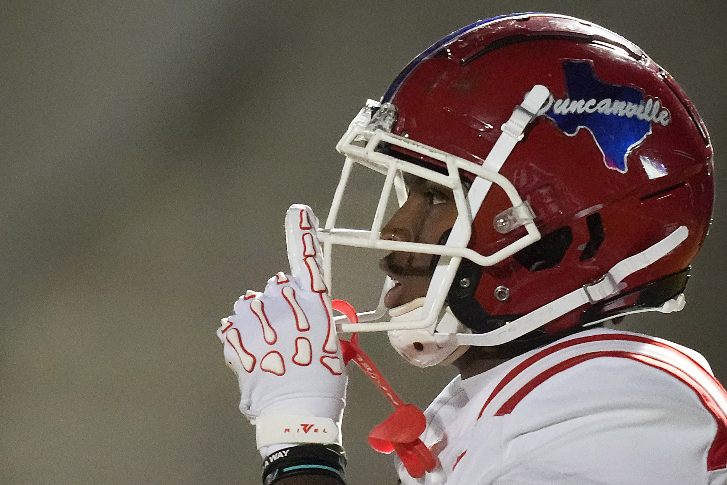 Duncanville wide receiver Dakorien Moore (1) celebrates after scoring on a 43-yard touchdown...