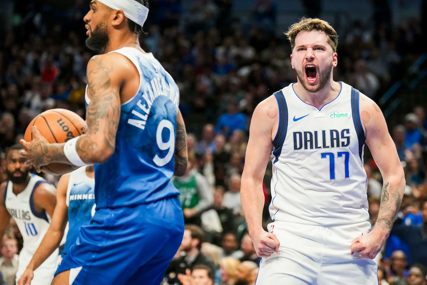 Dallas Mavericks guard Luka Doncic (77) celebrates after scoring past Minnesota Timberwolves...