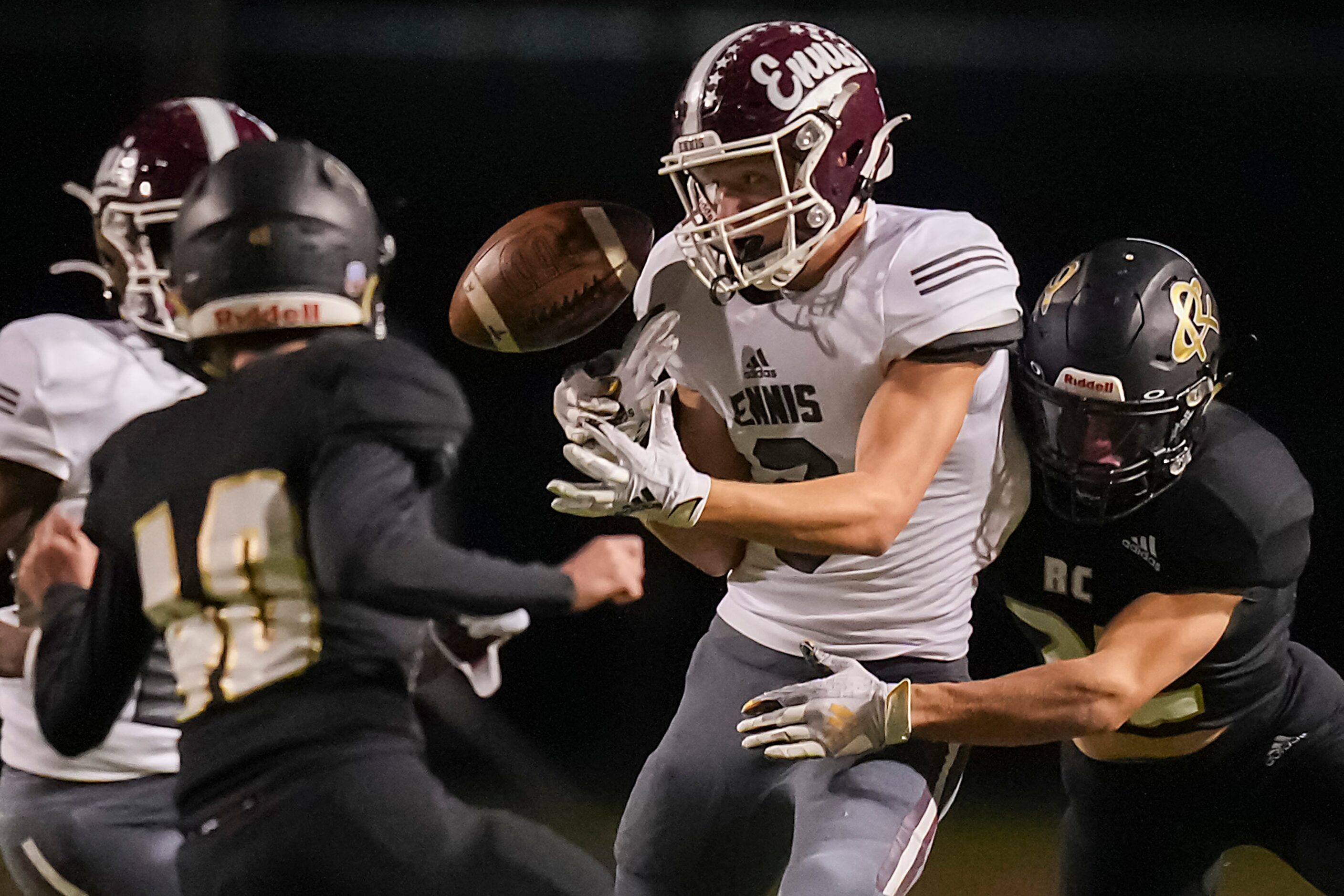 Ennis punt returner Ashton Ehly (3) fumbles on a hit from Royse City’s  Caleb Watkins...