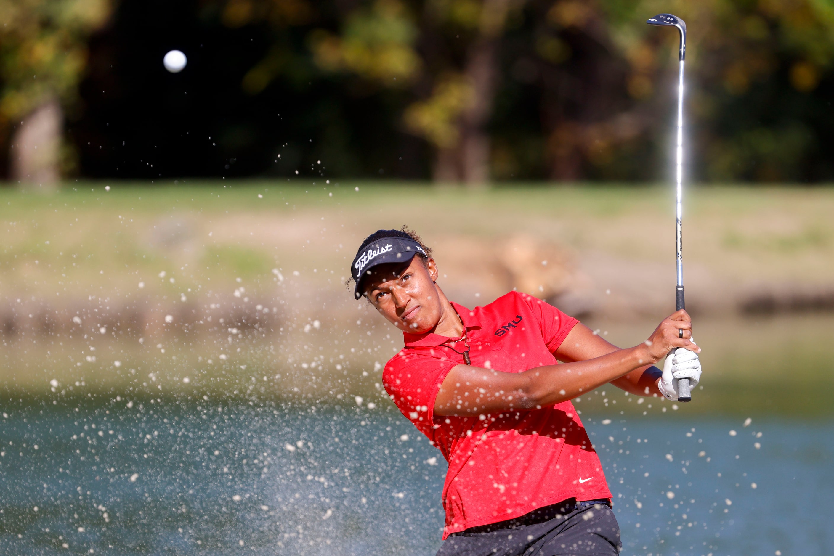 Emily Odwin of SMU hits out off a sand trap in the third hole during the Southwest Airlines...