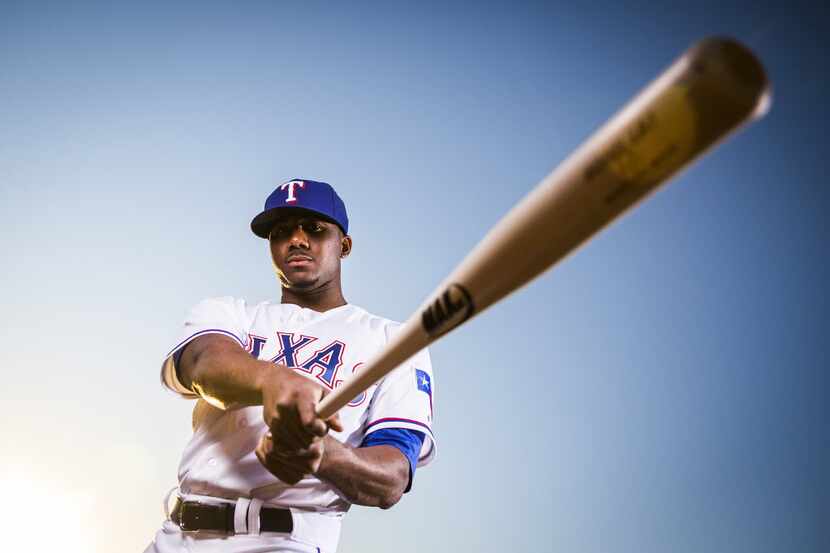 Texas Rangers oufielder Lewis Brinson photographed during spring training photo day at the...