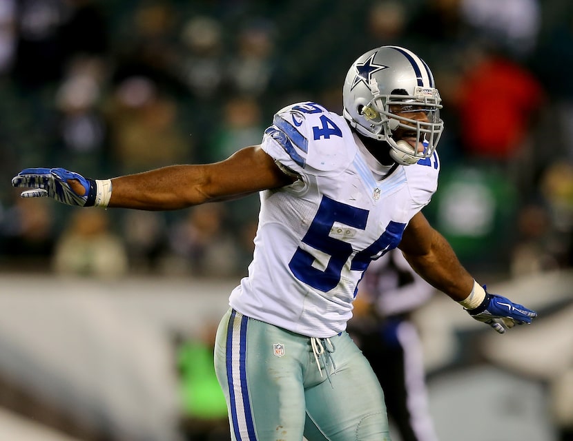 Bruce Carter #54 of the Dallas Cowboys celebrates after he intercepted a pass from Mark...