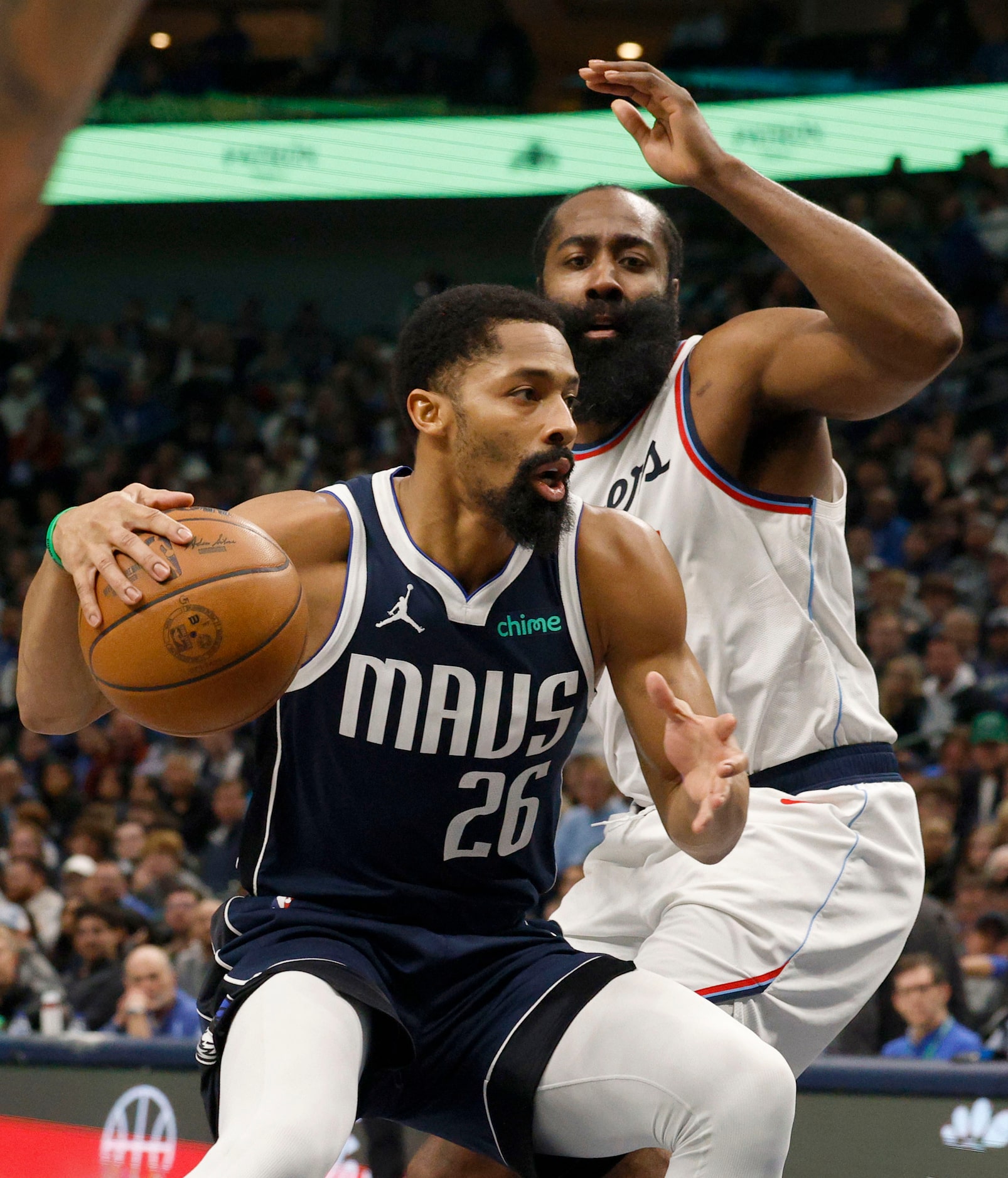 Dallas Mavericks guard Spencer Dinwiddie (26) keeps the ball away from LA Clippers guard...