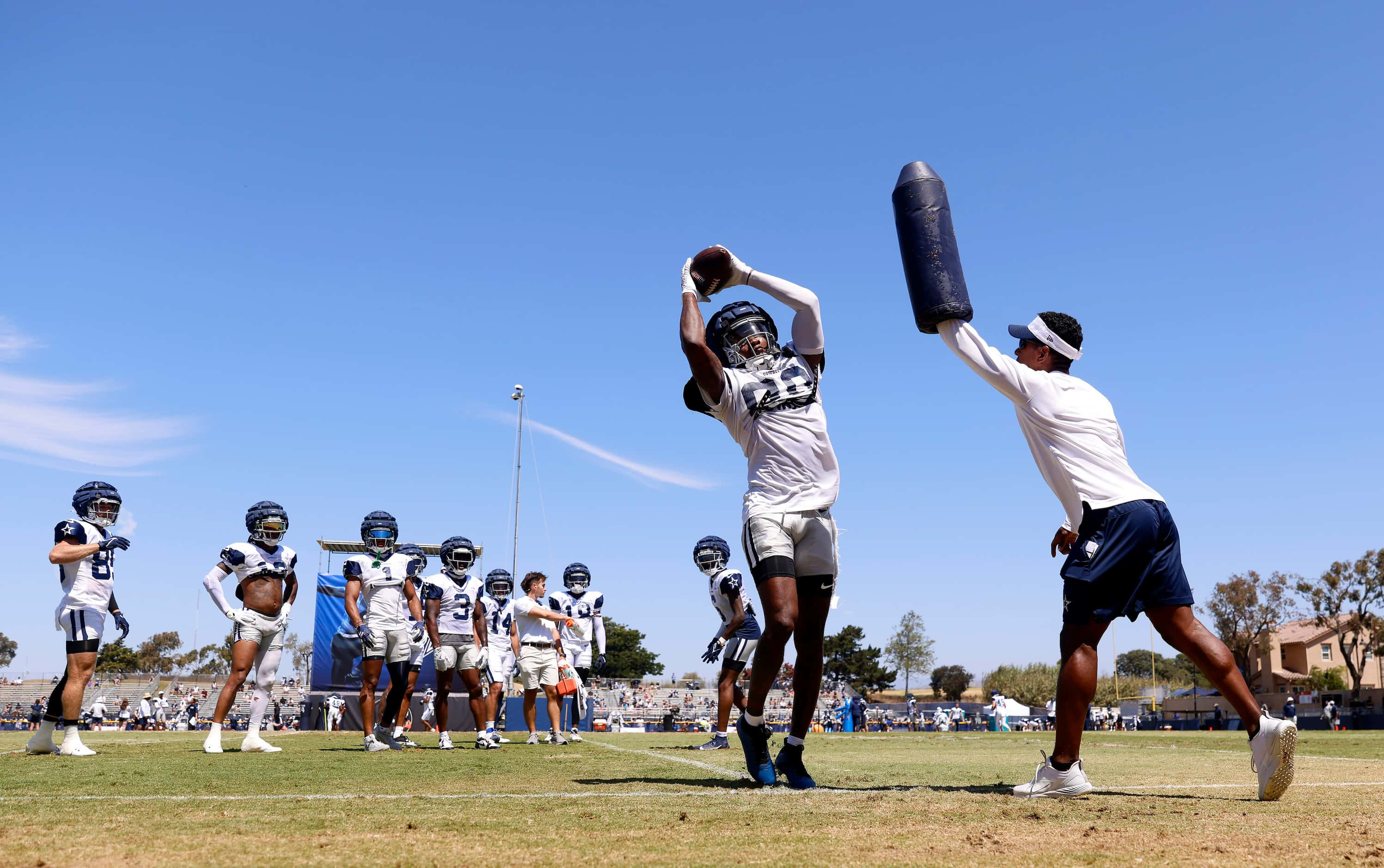 Dallas Cowboys wide receiver Racey McMath (80) pulls down a catch along the sideline before...