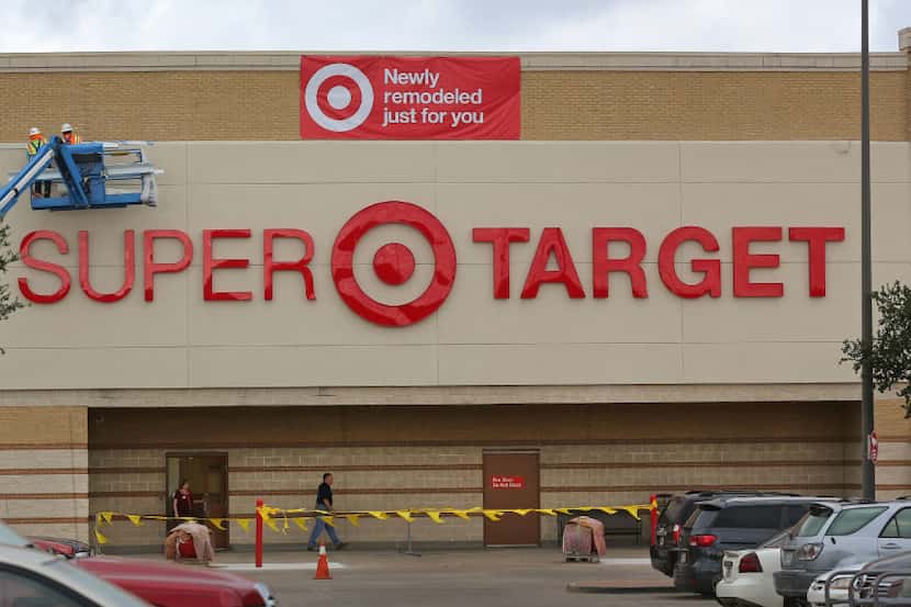 Crews put the finishing touches on the remodel at the Target store at Coit and Campbell in...