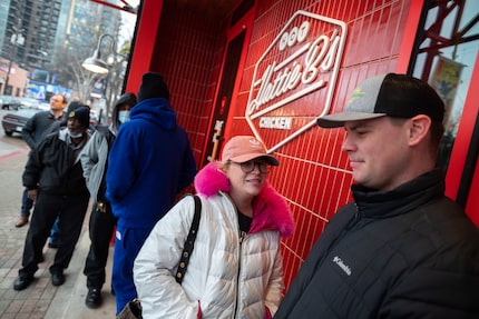 Ashley Kenner, 29, left, and Brian Kenner, 31, both of Colleyville, were the first in line...