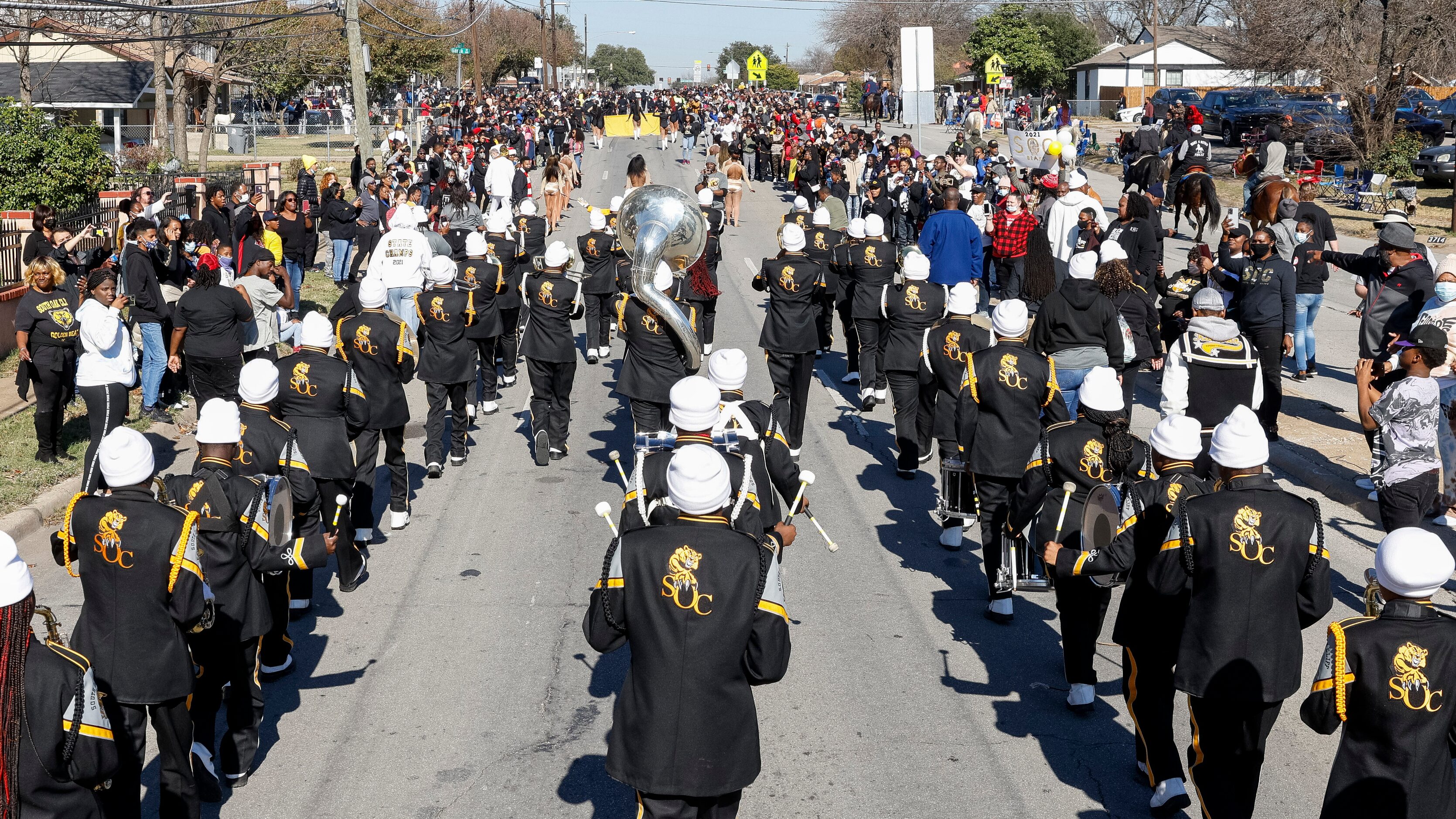 The South Oak Cliff Marching Band makes its way down Marsalis Avenue during a parade...