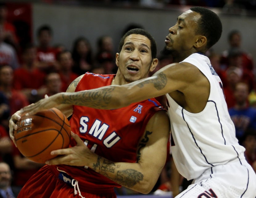 FILE - SMU guard Nic Moore( left) battles UConn guard Ryan Boatright (11) for possession...