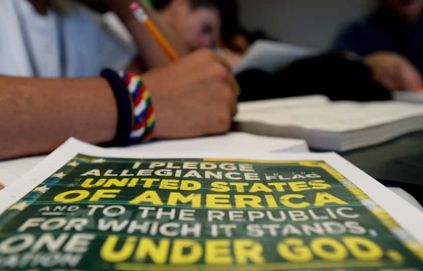 A copy of the Pledge of Allegiance sits on a table in a writing class at the U.S....