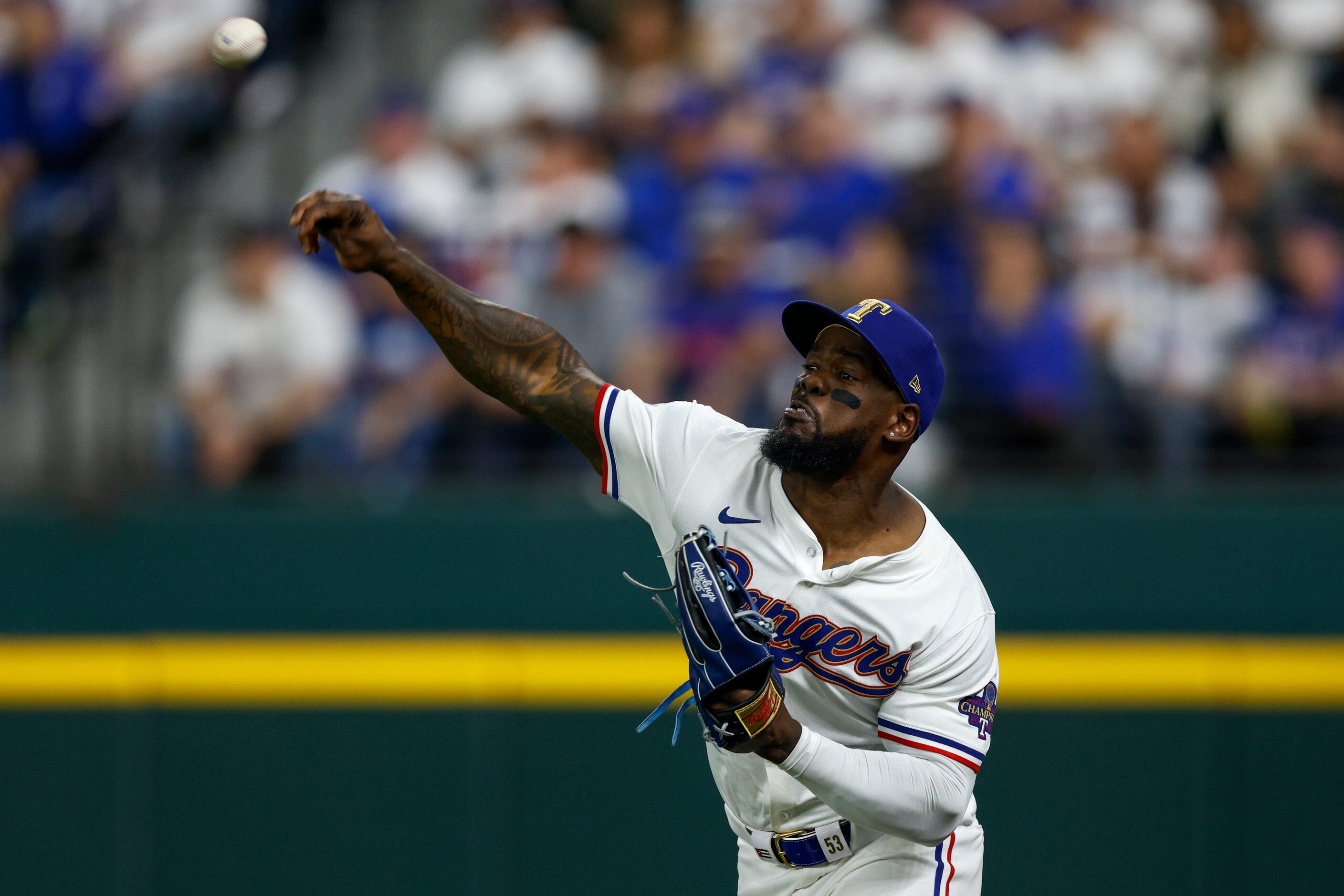 Texas Rangers right fielder Adolis Garcia (53) fields a hit during the sixth inning of the...