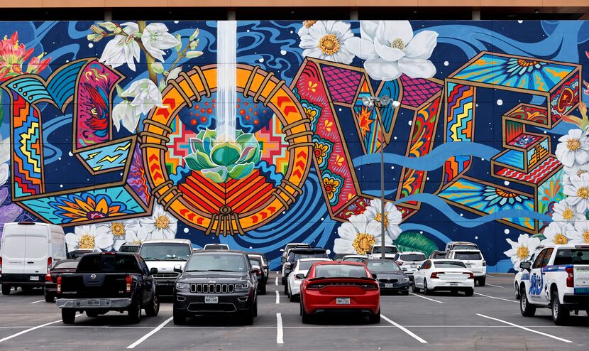 The Power of Love mural is painted on the north side of the Luminary Building in downtown...