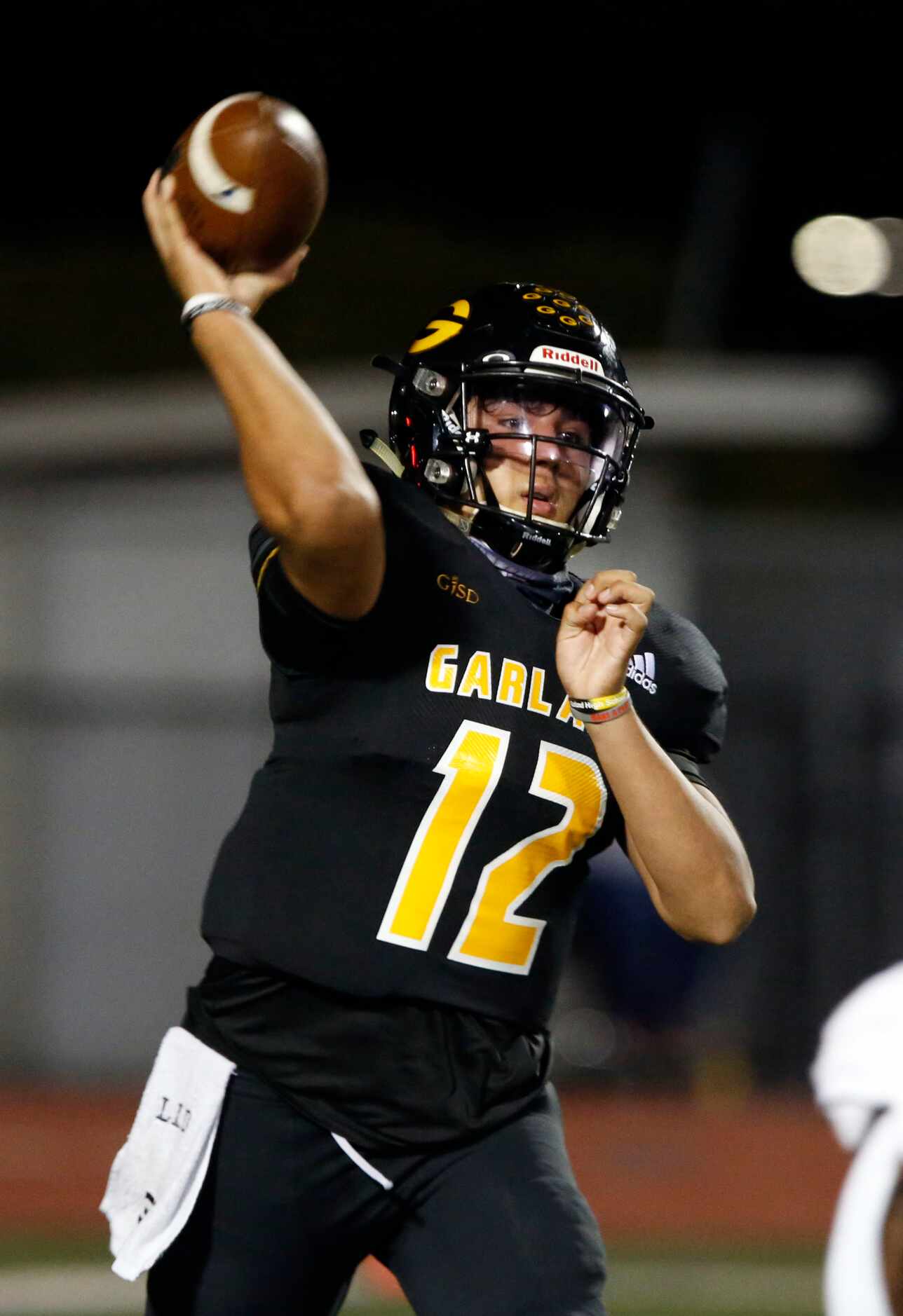 Garland QB Sergio Perez (12) throws a pass during the first half of high school football...