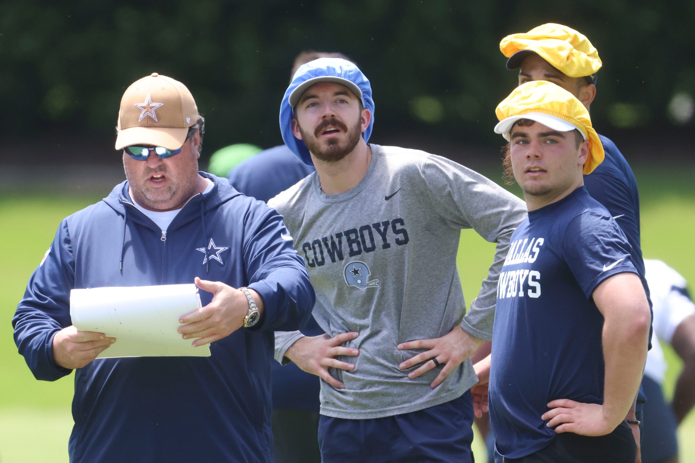 Dallas Cowboys defensive run game coordinator Paul Guenther (left) instructs his team...