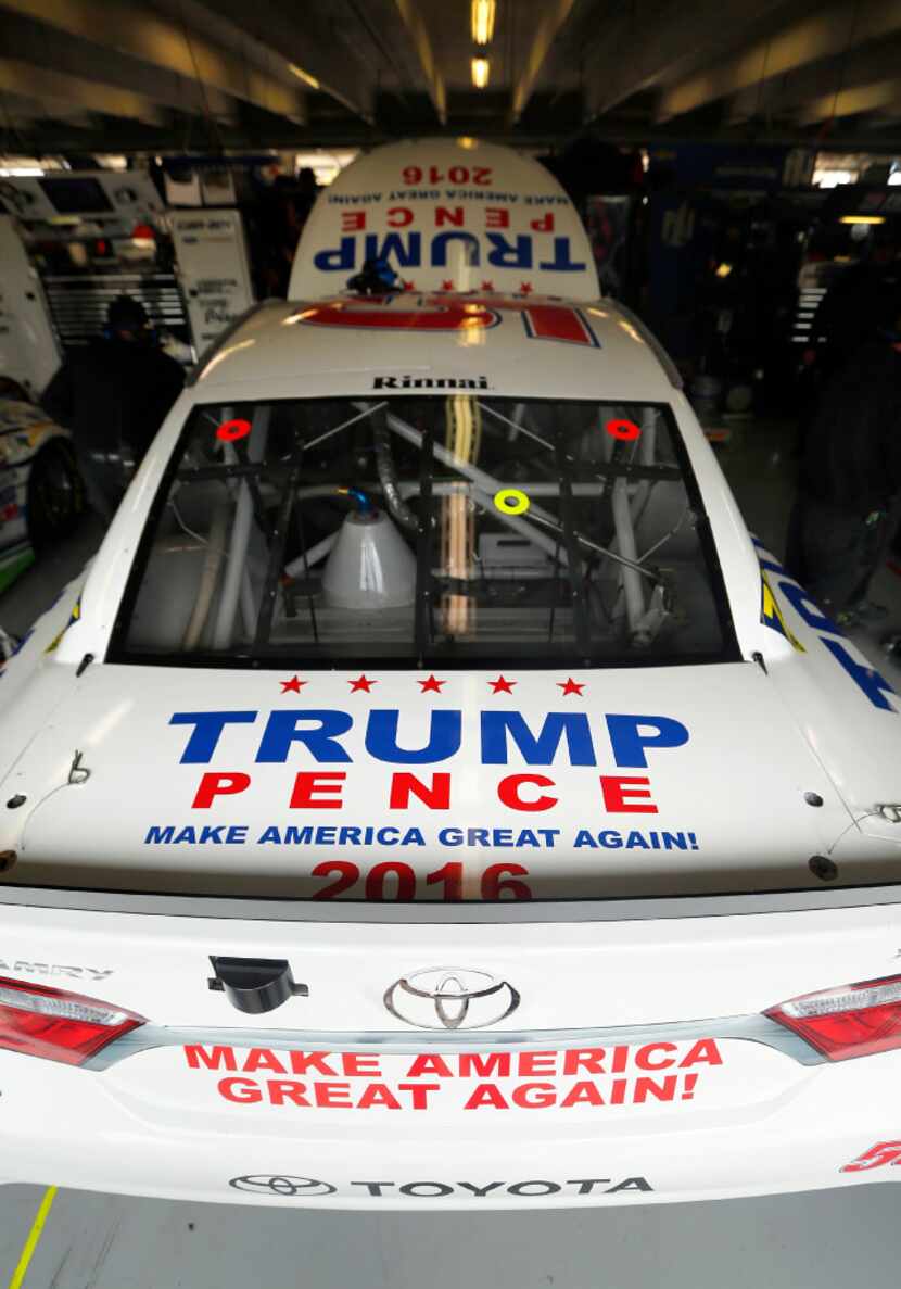 The presidential Donald Trump themed Sprint Cup series car sits on the blocks as crewman for...