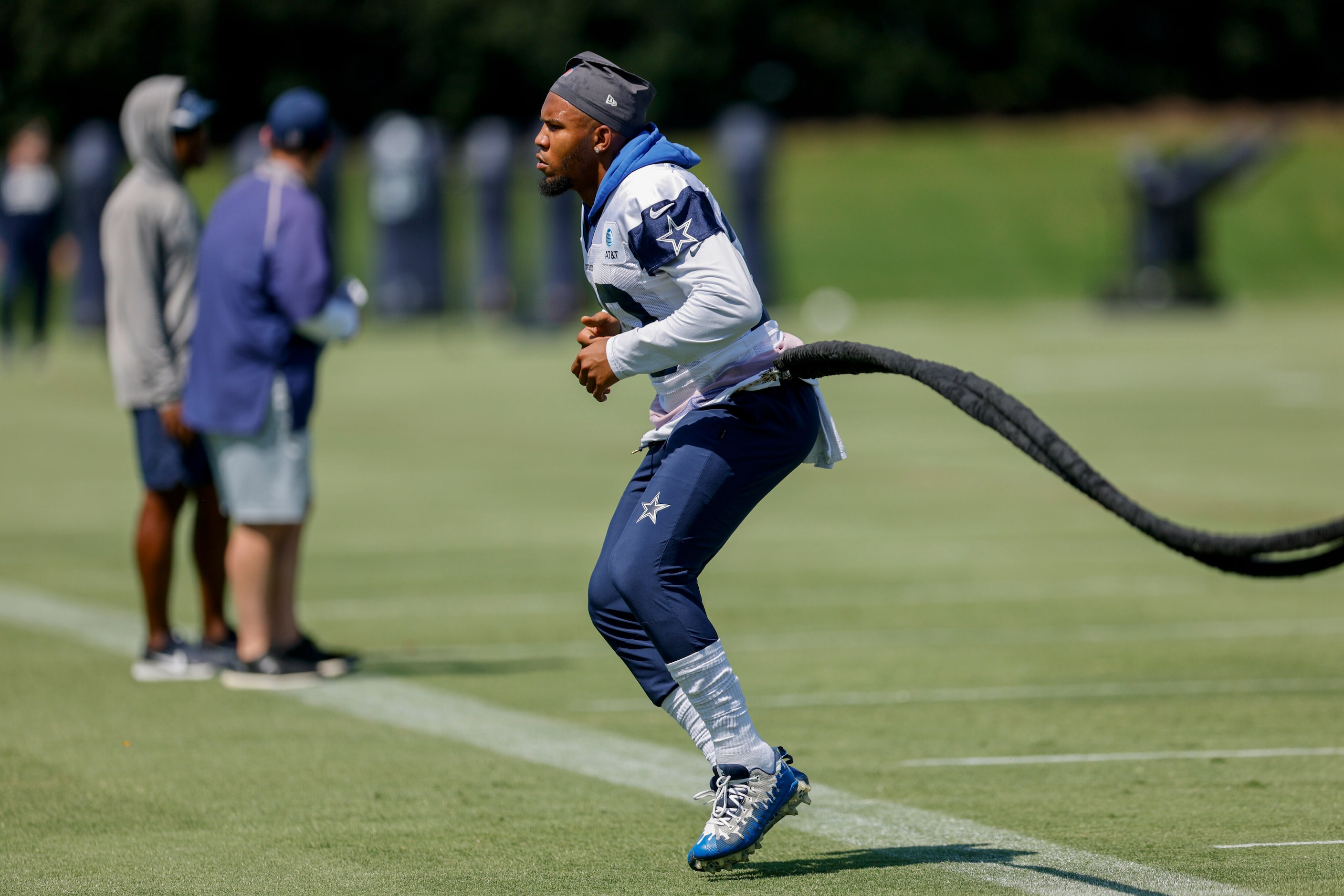 Dallas Cowboys running back Tony Pollard (20) works with a trainer during a practice at The...