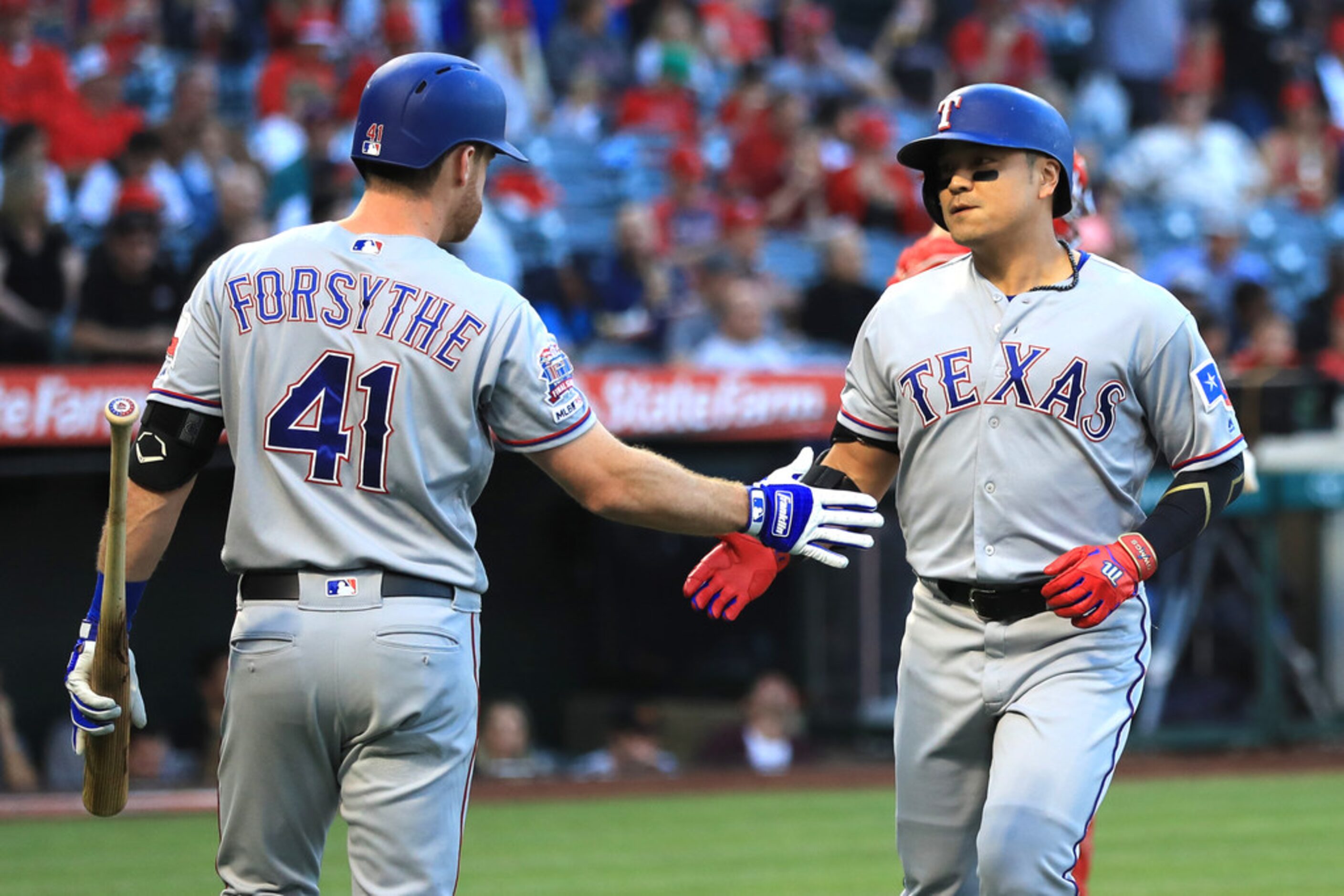 ANAHEIM, CALIFORNIA - MAY 24:  Logan Forsythe #41 congratulates Shin-Soo Choo #17 of the...