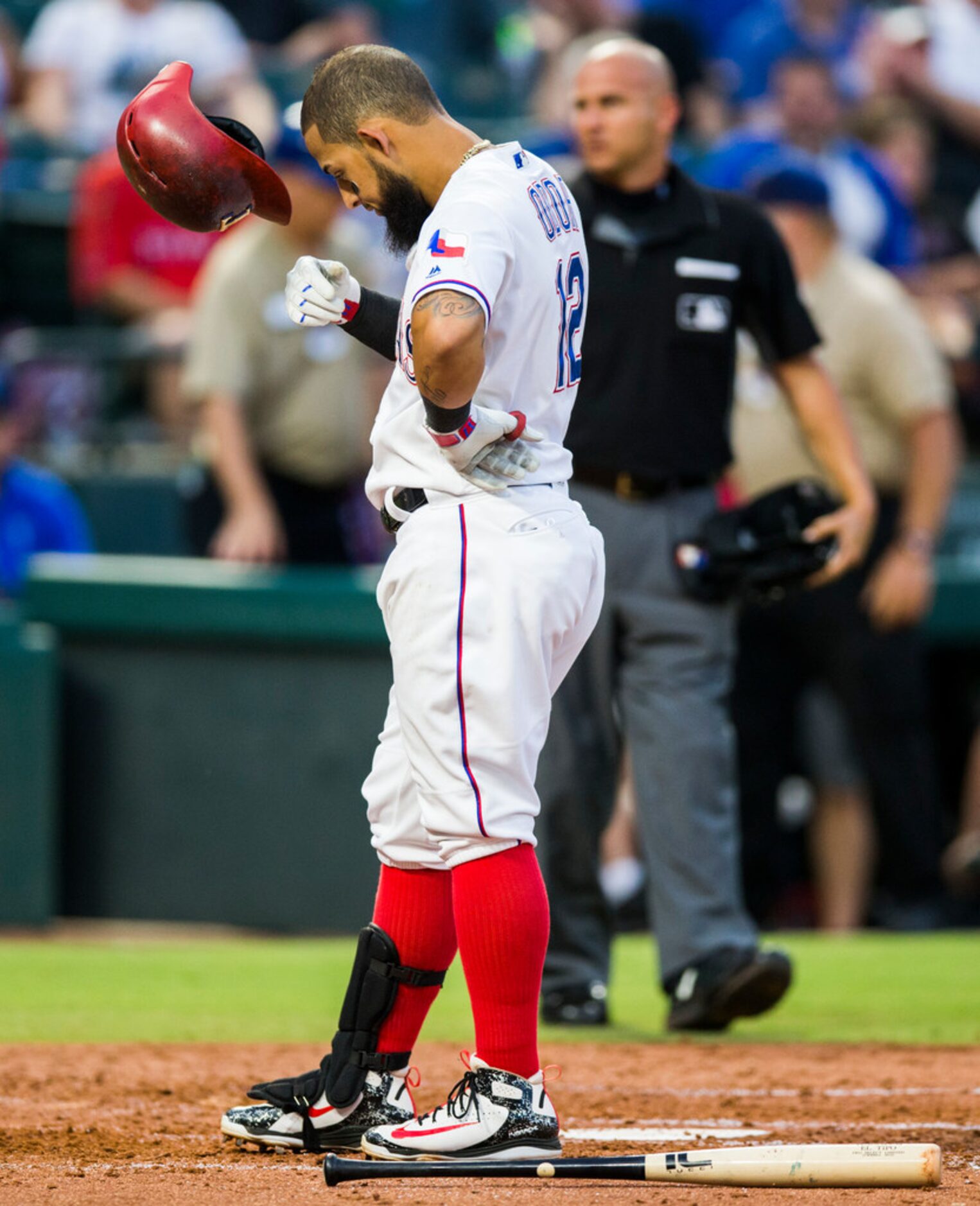 Texas Rangers second baseman Rougned Odor (12) reacts to striking out during the second...