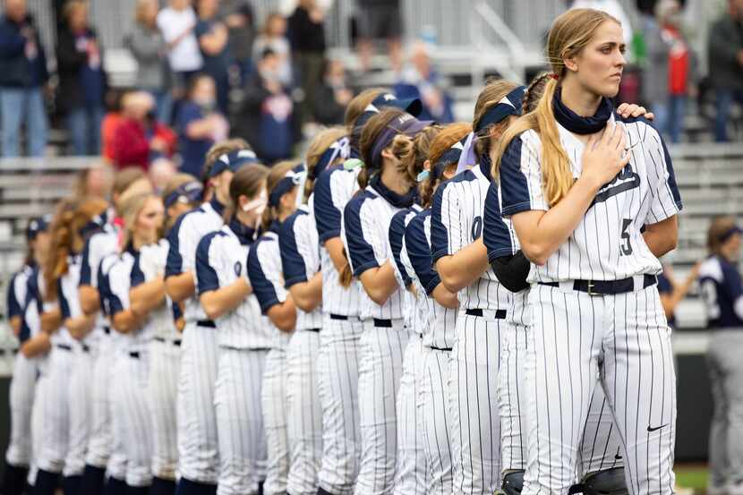 Flower Mound's pitcher Landrie Harris (15) stands with her team during the national anthem...