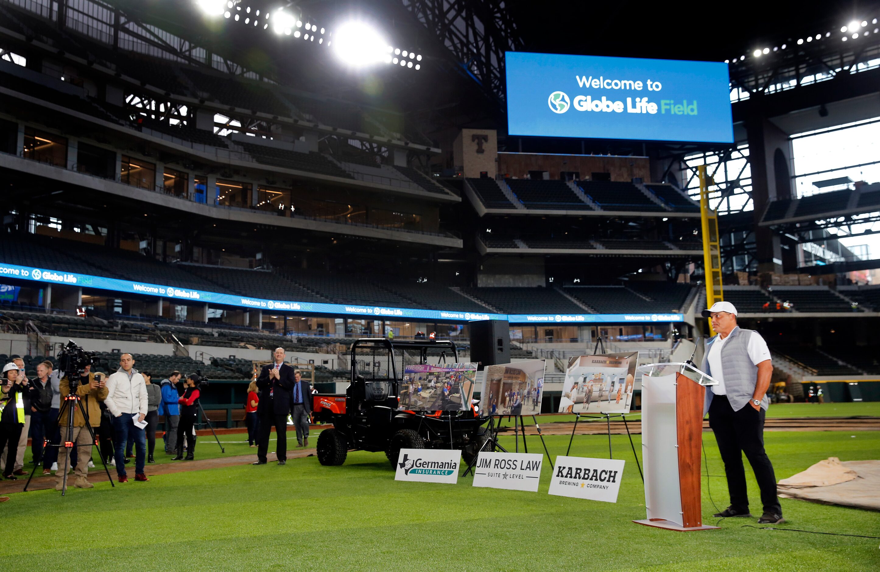 Former Texas Rangers catcher Ivan 'Pudge' Rodriguez speaks to the media from the infield  of...